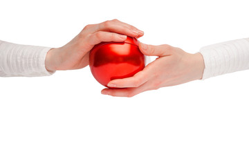 Close up of a woman hands holding a glass red ball