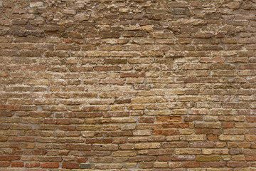 Texture di mattoni  nelle mura medievali della città di San Geminiano. La serie di mattone si trova alla base di una delle famosi torri medievali.