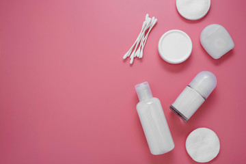 Beauty, cosmetics, hygiene products on pink background with copy space, flat lay skin care concept.