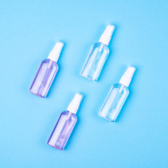 Antibacterial antiseptic spray for hands sanitizer on blue background.Prevention against virus, bacteria or coronavirus.