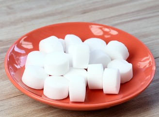 Pile of softener salt pellets in the bowl. Good for eco friendly cleaning the dishes