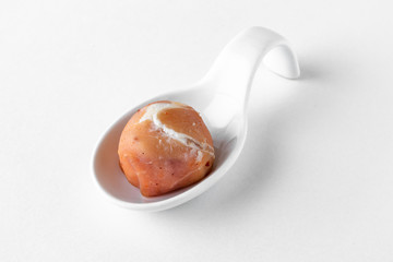 Serving appetizer is a curd cheese ball with delicious additives. Beautifully decorated catering banquet menu. Food snacks and appetizers for buffet. Isolated on white background