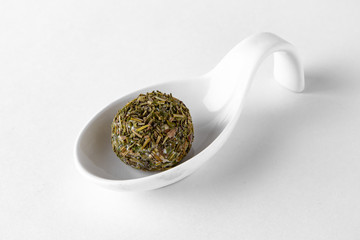 Serving appetizer is a curd cheese ball with delicious additives. Beautifully decorated catering banquet menu. Food snacks and appetizers for buffet. Isolated on white background