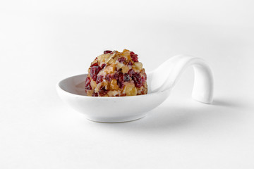 Serving appetizer is a curd cheese ball with delicious additives. Beautifully decorated catering...
