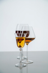 Three glasses of wine of different colors on a white background