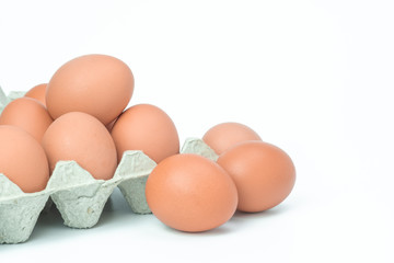 Chicken eggs in box on white background