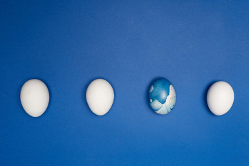 Blue eggs and white eggs ester isolated on blue backgound