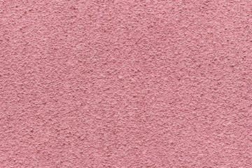 Fototapeta premium Rough pink wall texture background.