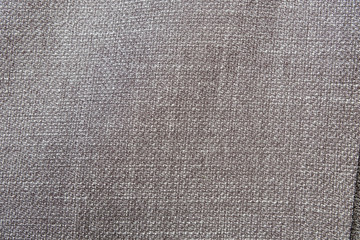Fototapeta na wymiar Selective focus, Close up shot of dark grey formal suit cloth textile surface. wool fabric texture for important luxury evening or night event. Wallpaper and background with copy space for text
