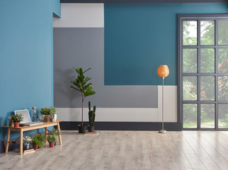 Decorative living room blue grey and white wall concept with black window. Wooden chair and...