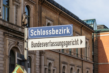 Direction Sign letters to Schlossbezirk and Bundesverfassungsgericht, BGH, engl. Federal Court of Justice of Germany