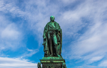 Detail view on Monument of Karl Friedrich von Baden with blue sky in background. Near Castle...