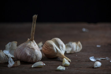 Garlic, on the old wooden table in the kitchen