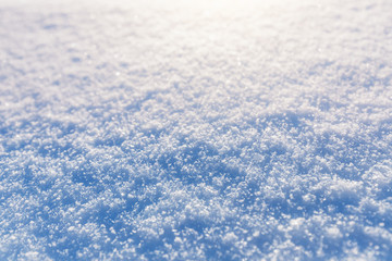 Large snowflakes lie on a snow bank. The concept of weather forecasts and the winter climate