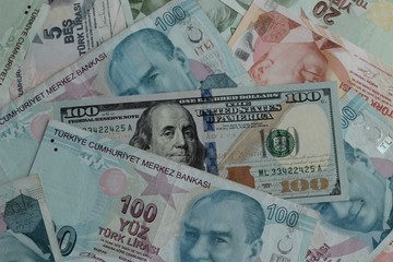 Fototapeta na wymiar One hundred dollar bill in Turkish banknotes,money background