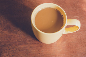 A yellow coffee cup on a wooden surface,Bulgaria, Close-up, Coffee - Drink, Coffee Cup, Cup 