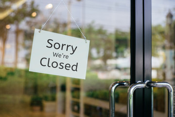 sorry we are closed sign hanging outside a restaurant, store, office or other - obrazy, fototapety, plakaty