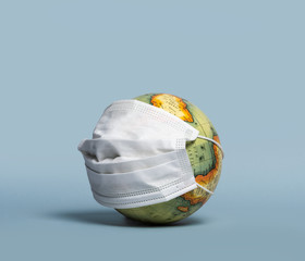 Earth wearing a face mask representing Global pandemic