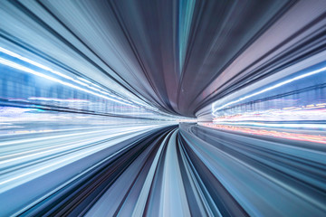 Motion blur of train moving inside tunnel with daylight in tokyo, Japan.