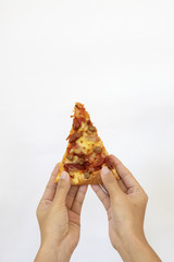 Slice of fresh  classic original Pizza held by hand