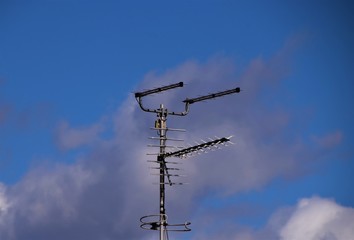 Obraz premium TV aerial antenna with blue sky background