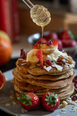 pankake breakfast with yogurt honey and strawberries