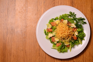 Ethical vegetarian or vegan meal. Boiled quail eggs in a spiralized fried potato french fries nest, Served with baby leaf salad. Healthy low calorie slimmer's meal made with a spiralizer.