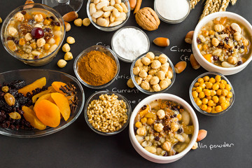 Traditional Dessert Noah Pudding or Asure bowls on black background with all ingredients.Written names of ingredients with handwriting near them.