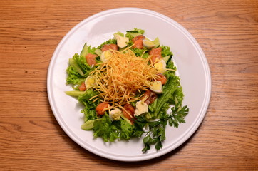 Ethical vegetarian or vegan meal. Boiled quail eggs in a spiralized fried potato french fries nest, Served with baby leaf salad. Healthy low calorie slimmer's meal made with a spiralizer.
