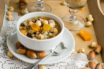 Traditional Noah Pudding,Ashura or Asure in white bowl on the wooden tray.Conceptual image of Asure Day.
