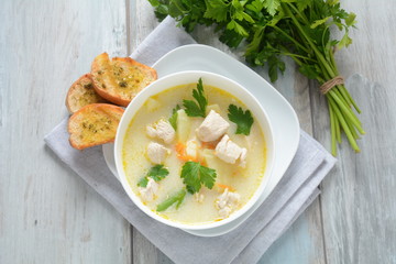 Creamy soup with chicken and vegetables 