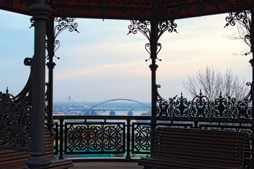 Close-up view of spring morning landscape in Kyiv. View from observation deck with a gazebo in the Saint Volodymyr Hill (Vladimirskaya Gorka). Ukraine. View of Dnipro River and the surrounding area