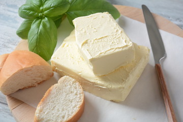 Butter. Slice of butter with basil