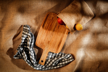 Flat light brown beige linen background seen from above with copy space for advertising products.
