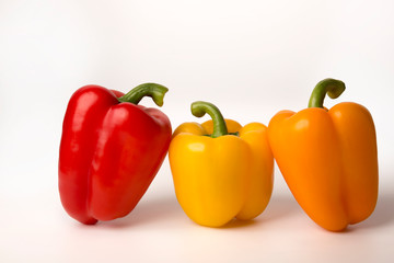 colorful bell peppers isolated on white background