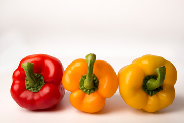 colorful bell peppers isolated on white background