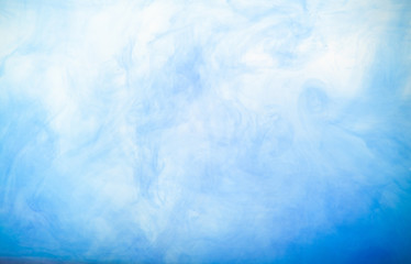 Fototapeta na wymiar blue paint in water on background
