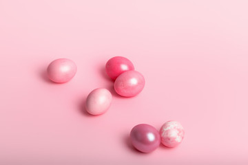 Fototapeta na wymiar Pink colored eggs on a pink background.