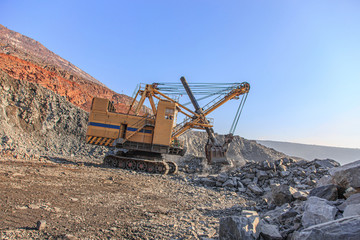 Fototapeta premium Old big mining excavator in an iron ore quarry