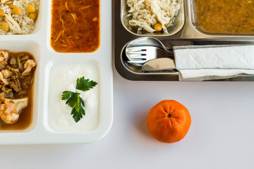 Traditional Turkish rice, cooked with chickpeas and chicken, vermicelli soup, yogurt and colorful pickles on portion trays (table d'hote)