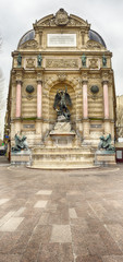 Closed businesses and deserted street in front of Saint Michel fountain, touristic Latin Quarter area, usually crowded.