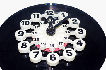 Wall clock for 24 hours made from a music disc. Isolated on white.