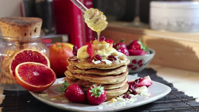 breakfast pancakes strawberries banana yogurt honey
