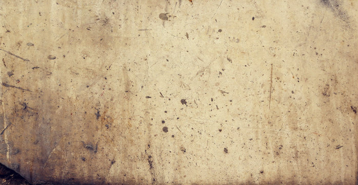 Warm yellow or beige blank marble surface with diry and damaged irregular texture - background for a horizontal header banner