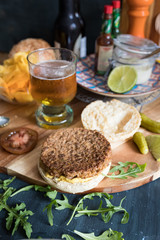 Amazing veggie lunch with a healthy quorn burger without the top sesame bread cover. The absolute essential beer jar is also here.