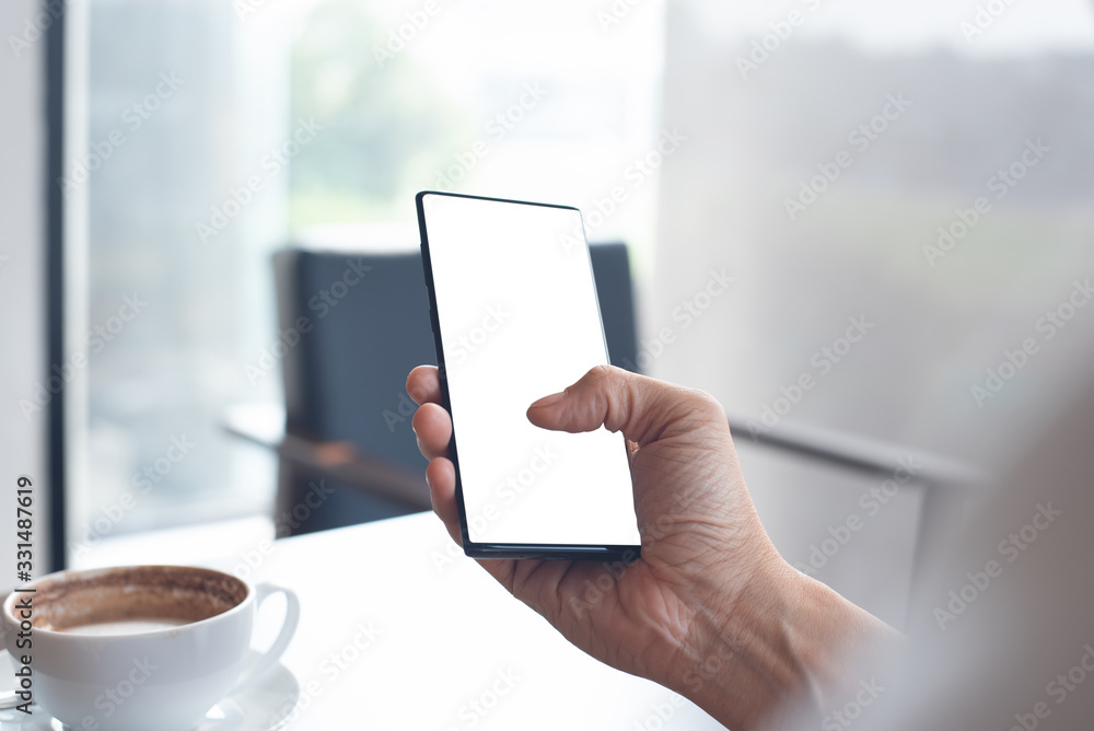 Poster mockup of man using smartphone in cafe