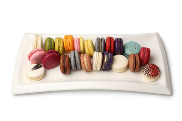 Colorful french macaroons in white dish