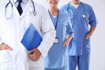 Doctors against light background, closeup. Medical service