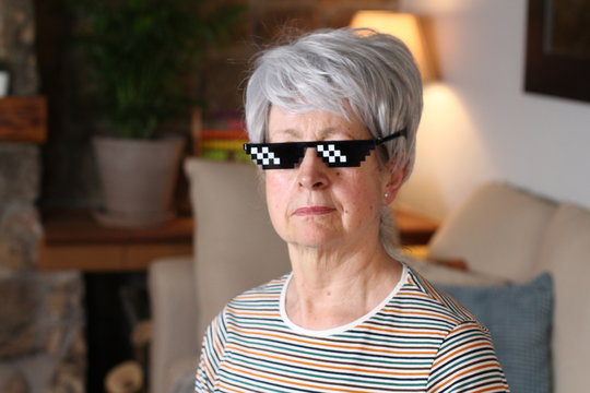 Senior woman wearing pixelated sunglasses 