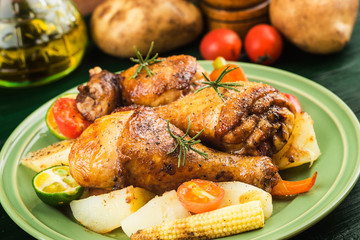 Grilled chicken leg with boiled potatoes and vegetable